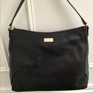 NWOT Kate Spade black leather hand bag with gold hardware.